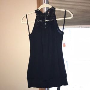 Black crochet at the neck tank